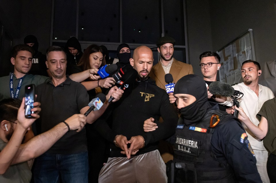 Andrew Tate and his brother Tristan are escorted outside the Directorate for Investigating Organised Crime and Terrorism (DIICOT), in Bucharest, Romania