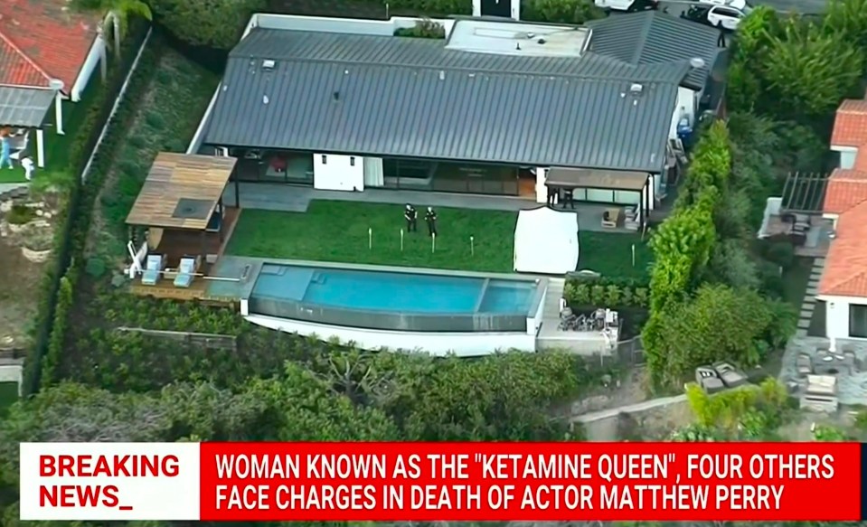 an aerial view of a house with a breaking news headline