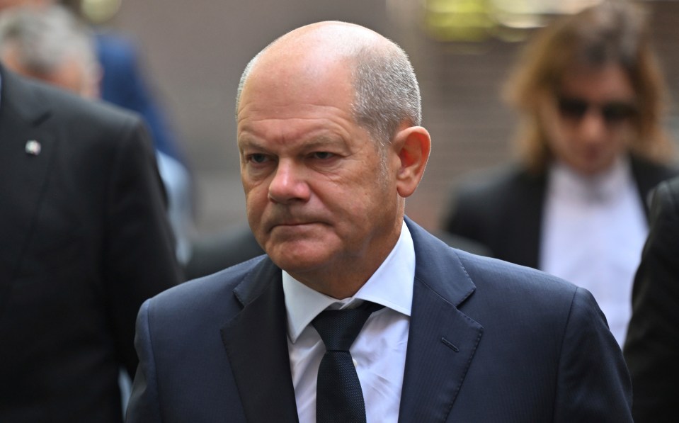 German Chancellor Olaf Scholz looked solemn as arrived at the scene on Monday