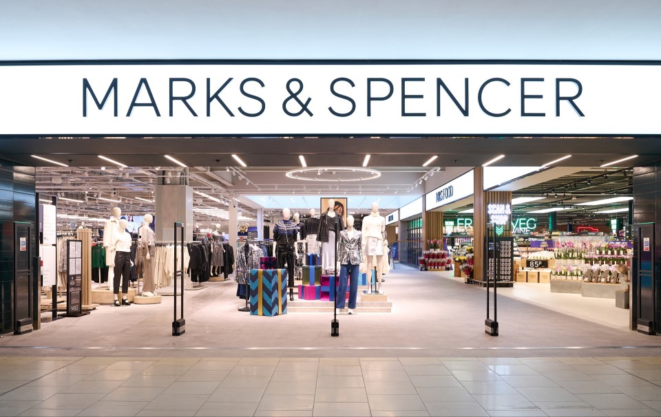 a marks & spencer store with mannequins in front of it