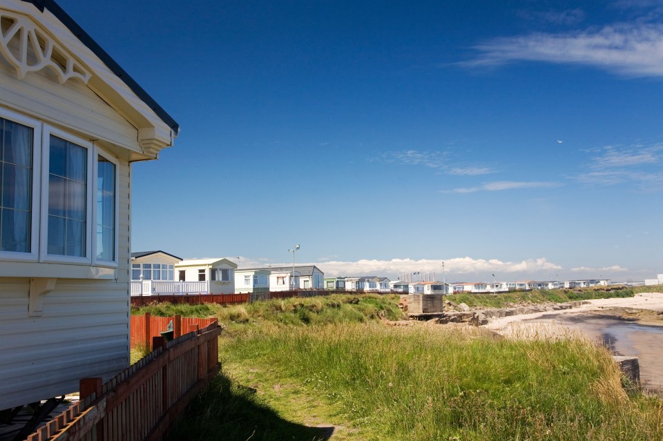 a row of mobile homes on a sunny day