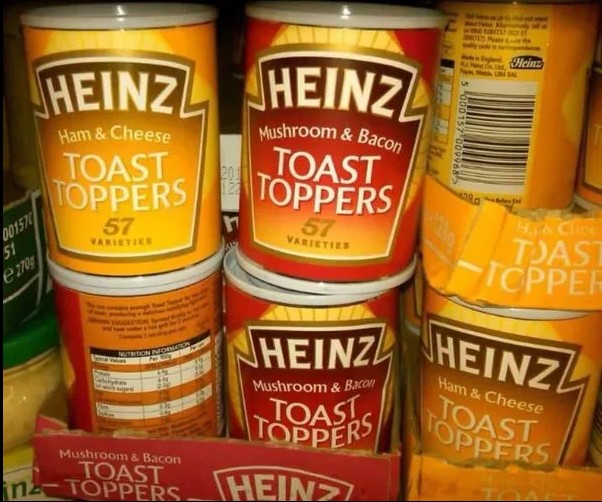 several cans of heinz toast toppers are stacked on top of each other