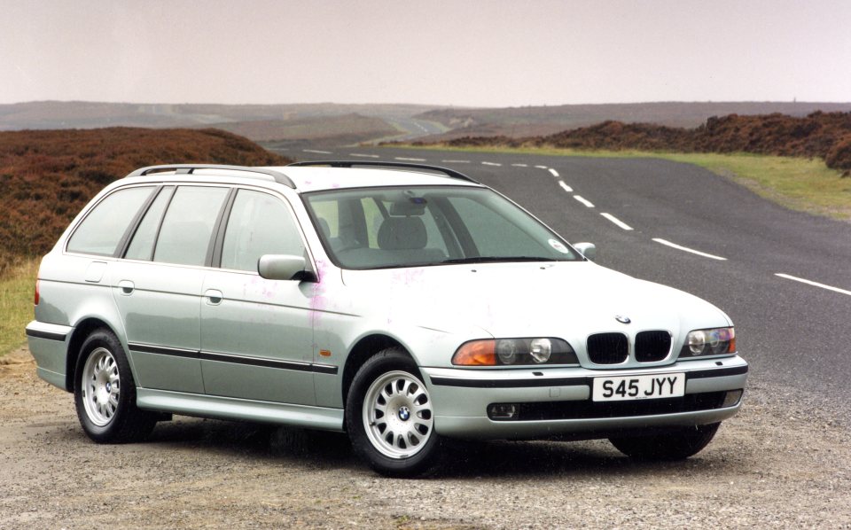 a silver bmw with a license plate that says s45 jyy