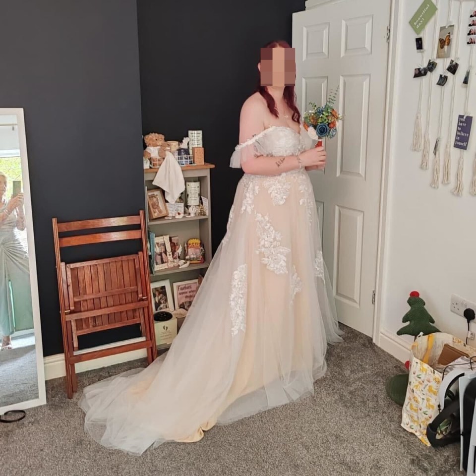 a woman in a wedding dress is standing in front of a mirror