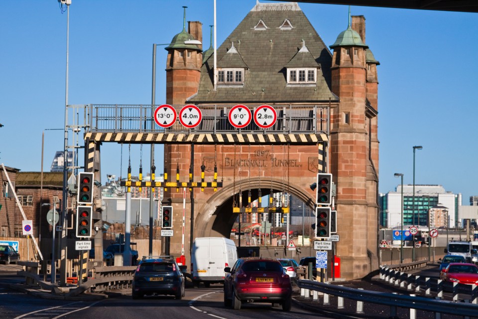 a red car is driving through the blackpool tunnel