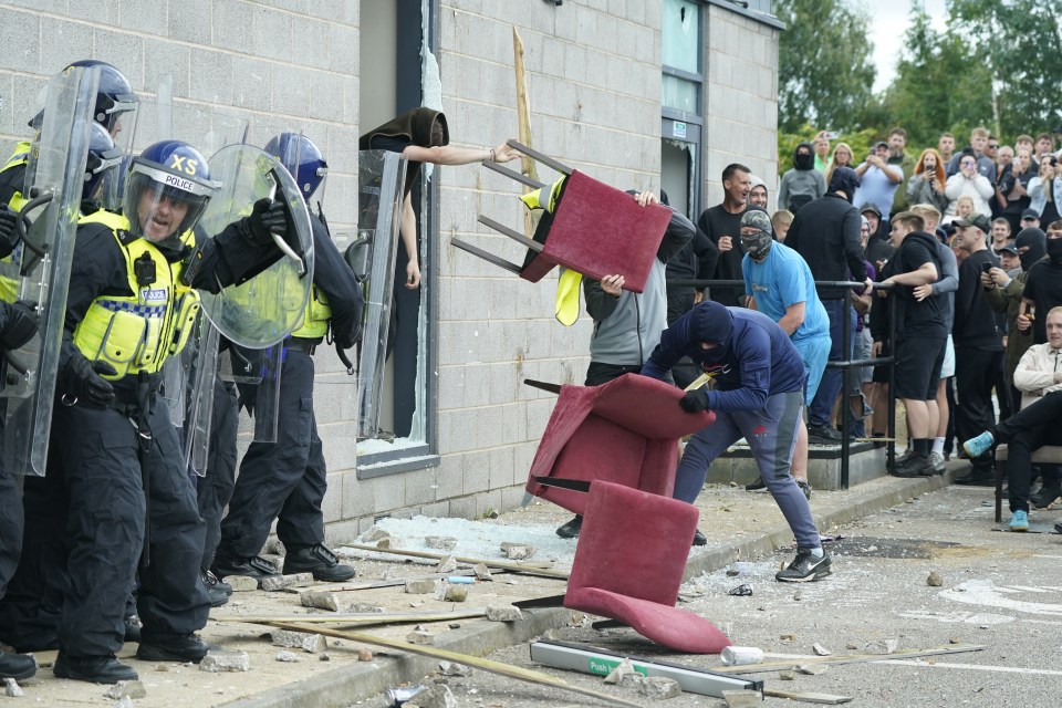 Vile scenes as yobs threw chairs at cops outside the Holiday Inn Express in Rotherham