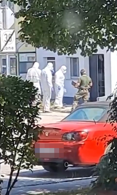 Officers in hazmat suits also searched the home in south Austria