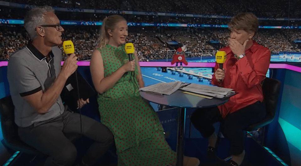 a man and two women are sitting at a table with microphones that say bbc sport