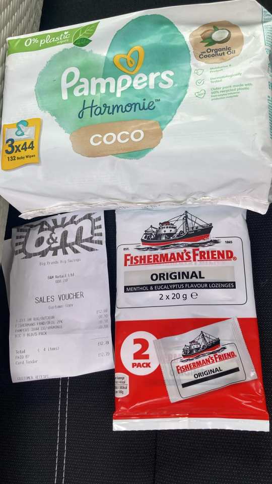 a packet of fisherman 's friend lozenges sits next to a pack of pampers wipes