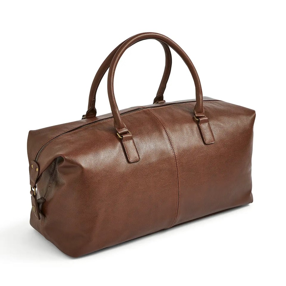 a brown leather duffel bag with two handles and a zipper