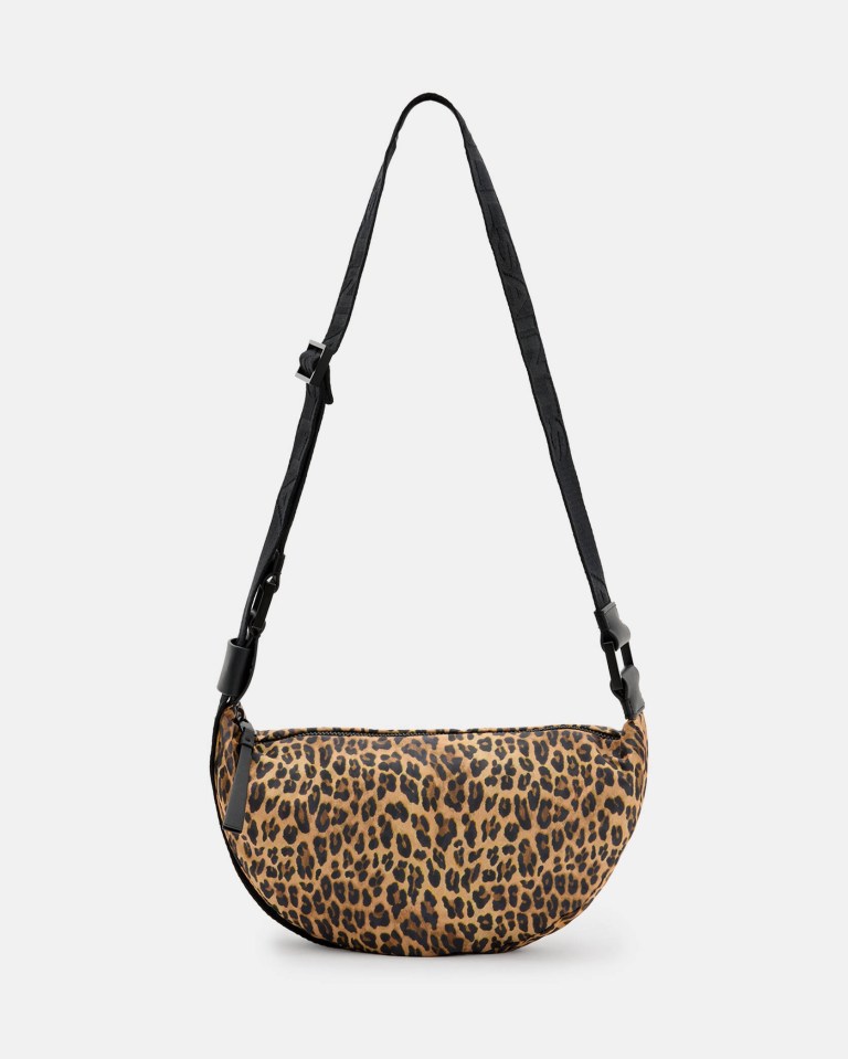 a leopard print bag with a black strap