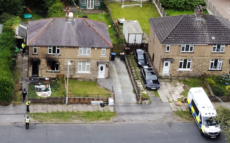 a police van is parked in front of a house