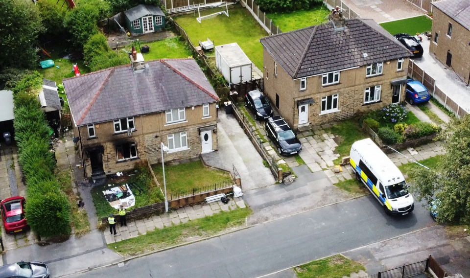 a police van is parked in front of a house