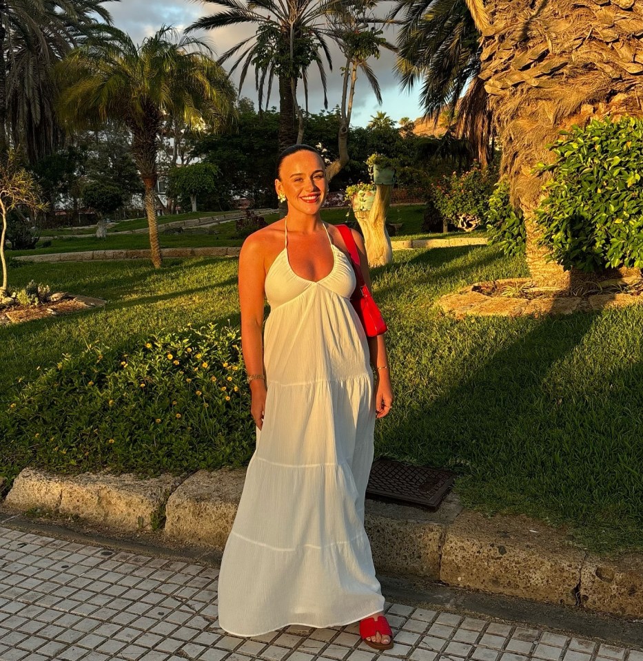 The star beamed with a stunning tan in a white sundress in one pic