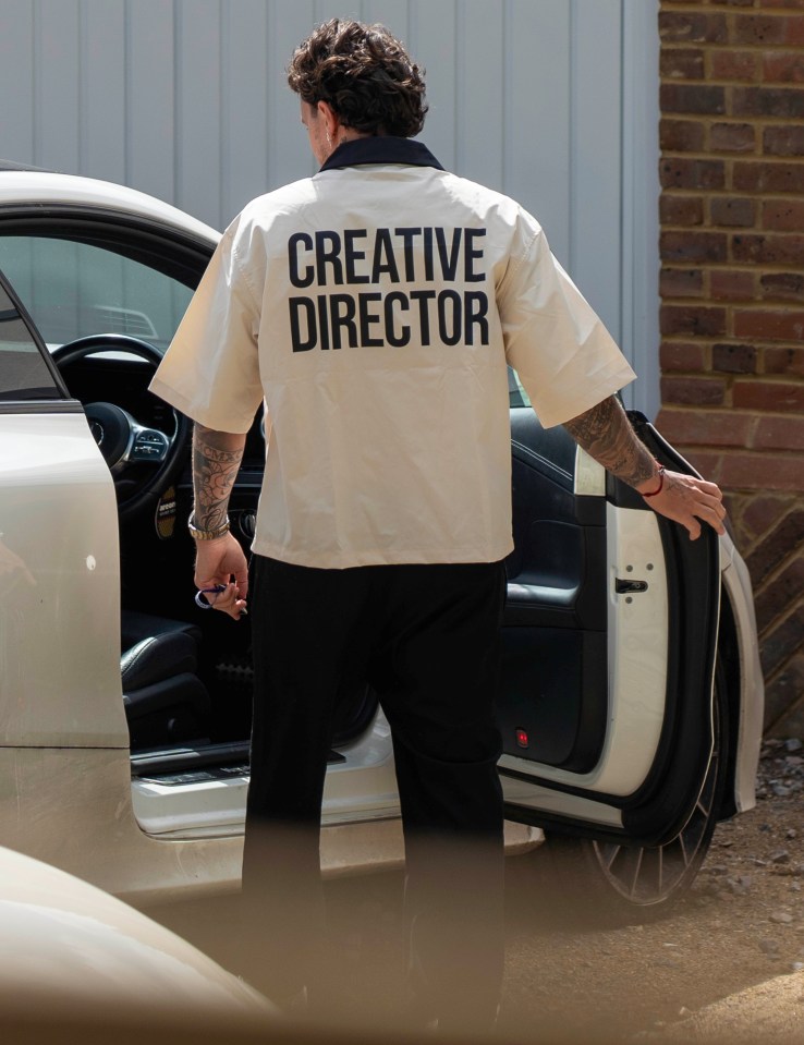 a man wearing a shirt that says creative director