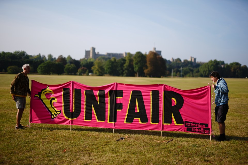 Demonstrators set up a banner at the site south of the town of Windsor