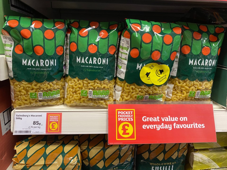 three bags of macaroni sit on a shelf with a sign that says great value on everyday favourites