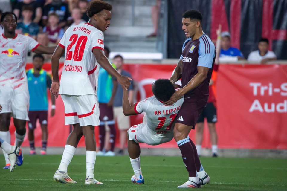 Aston Villa's Diego Carlos locked horns with Leipzig's Lois Openda