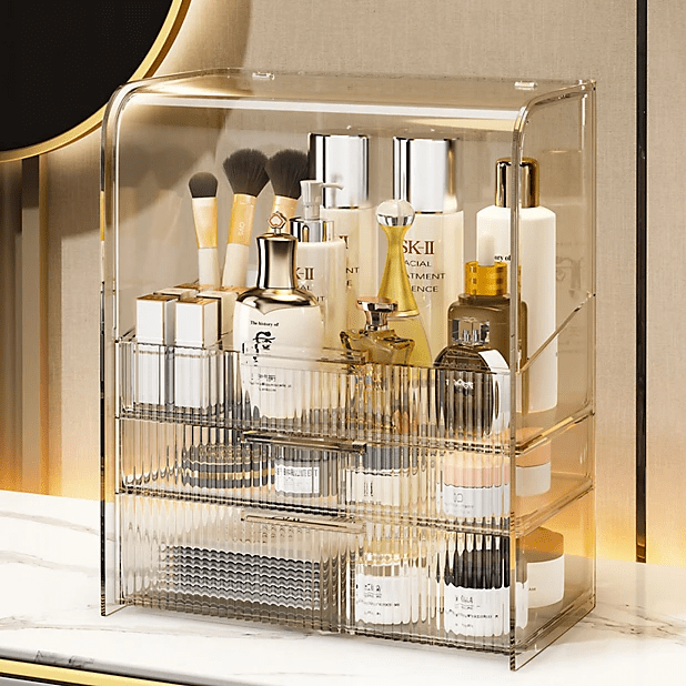 a clear acrylic container holds a variety of beauty products including skii facial treatment essence