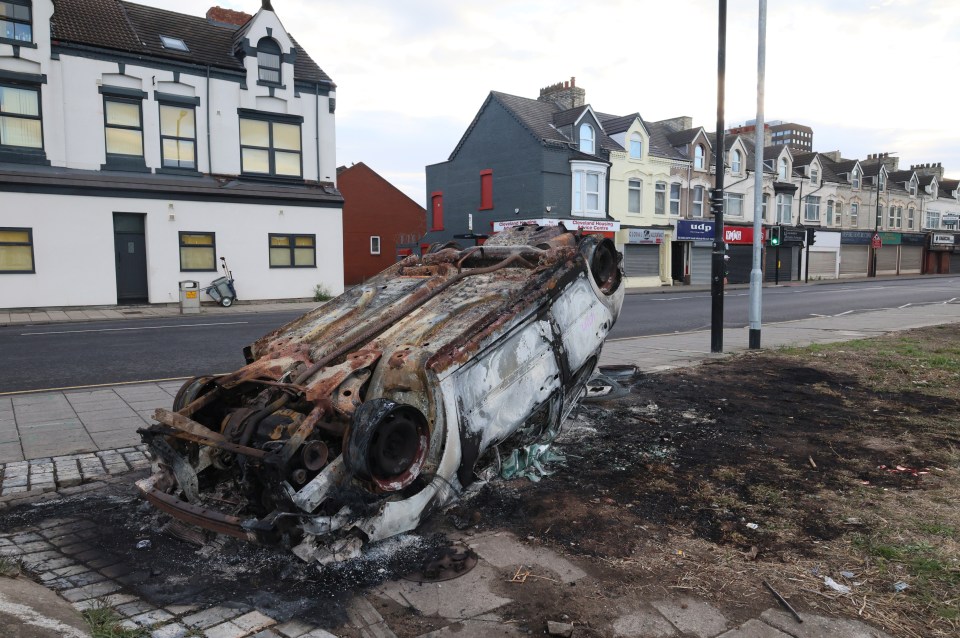 A torched upside-down car in Middlesbrough this morning