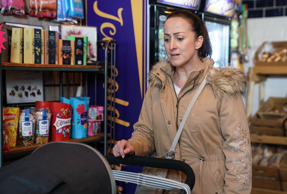 a woman pushing a stroller in a store with a sign that says jewelled