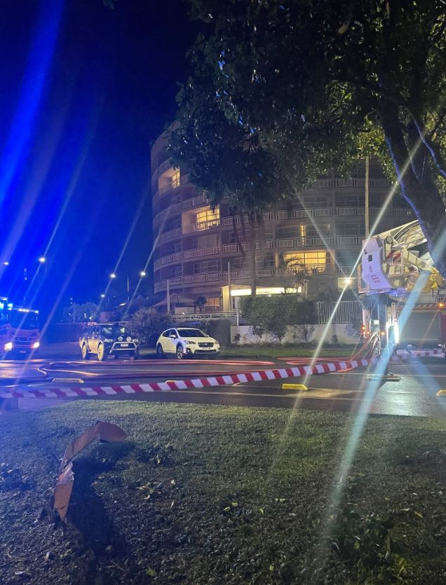 A piece of the helicopter lay on a berm outside the hotel