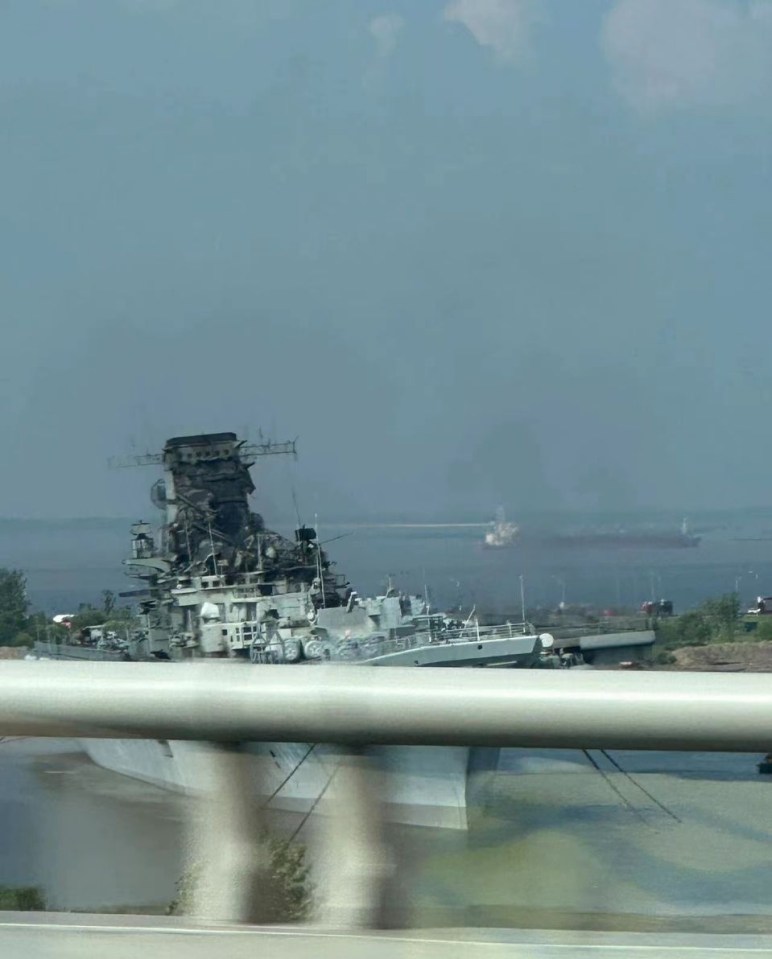 a large ship is sitting in the middle of a body of water