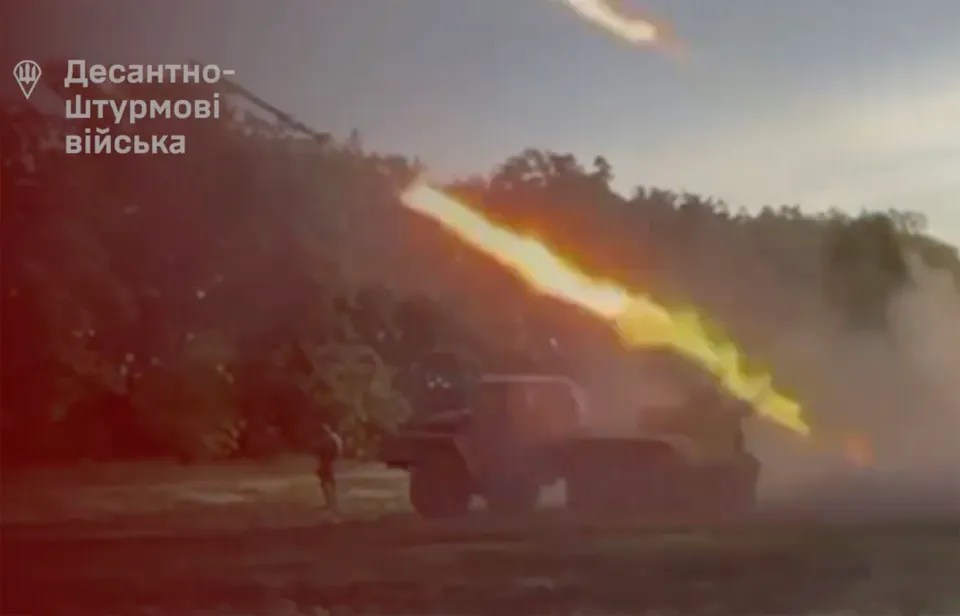 a rocket is being launched from a military vehicle