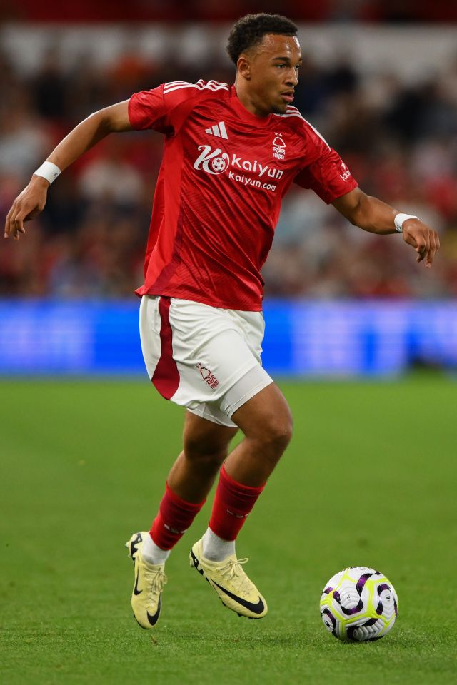 a soccer player wearing a red shirt that says kaiyan on it