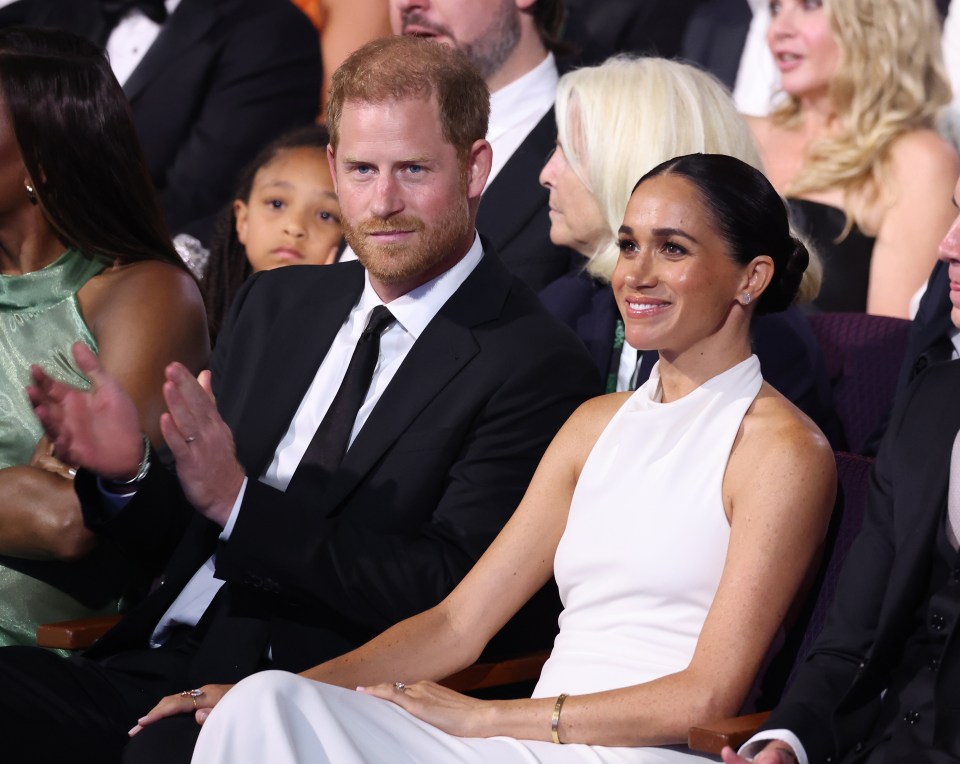 Samantha claims Meghan, pictured with Prince Harry,  caused her to face 'relentless torment online'