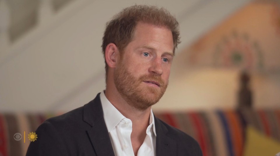 a man with a beard wearing a suit and white shirt