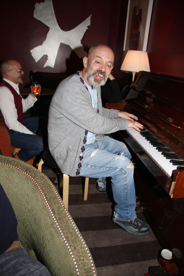 Keith Allen playing a piano at the club in 2008