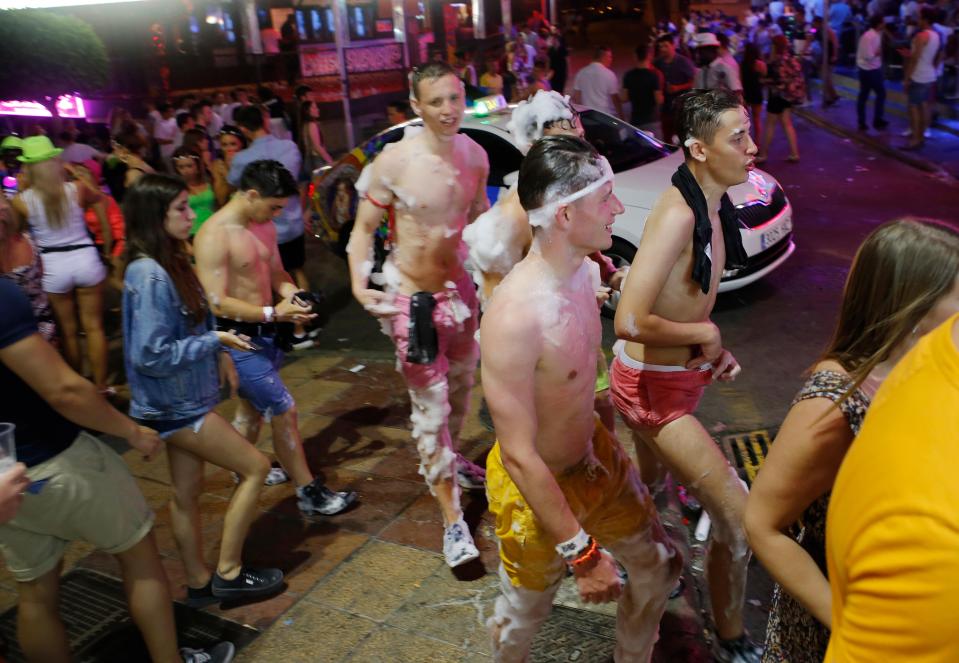 Young Brit tourists covered in foam while enjoying a holiday in Spain