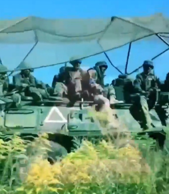 Ukraine's troops were captured piling in on armoured vehicles