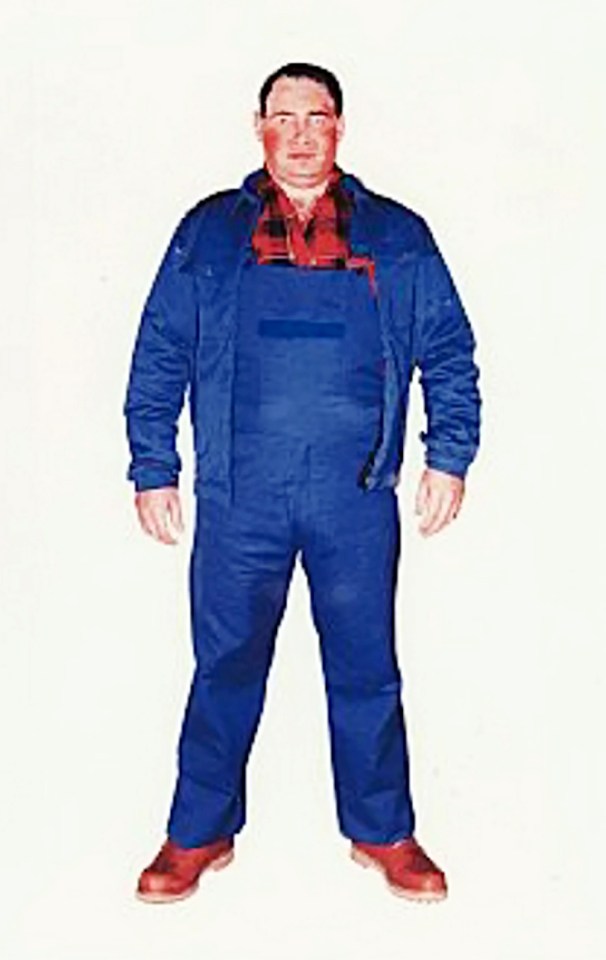 a man wearing blue overalls and a blue jacket