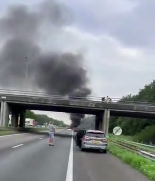 Drivers got out of their cars and watched the blaze unfold