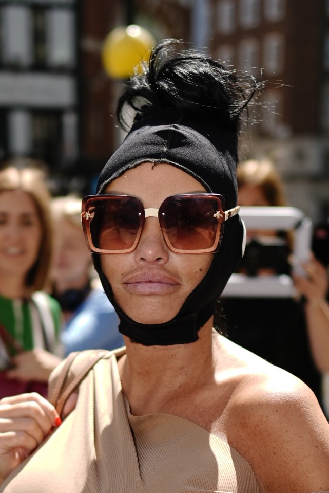 a woman wearing sunglasses and a black headband