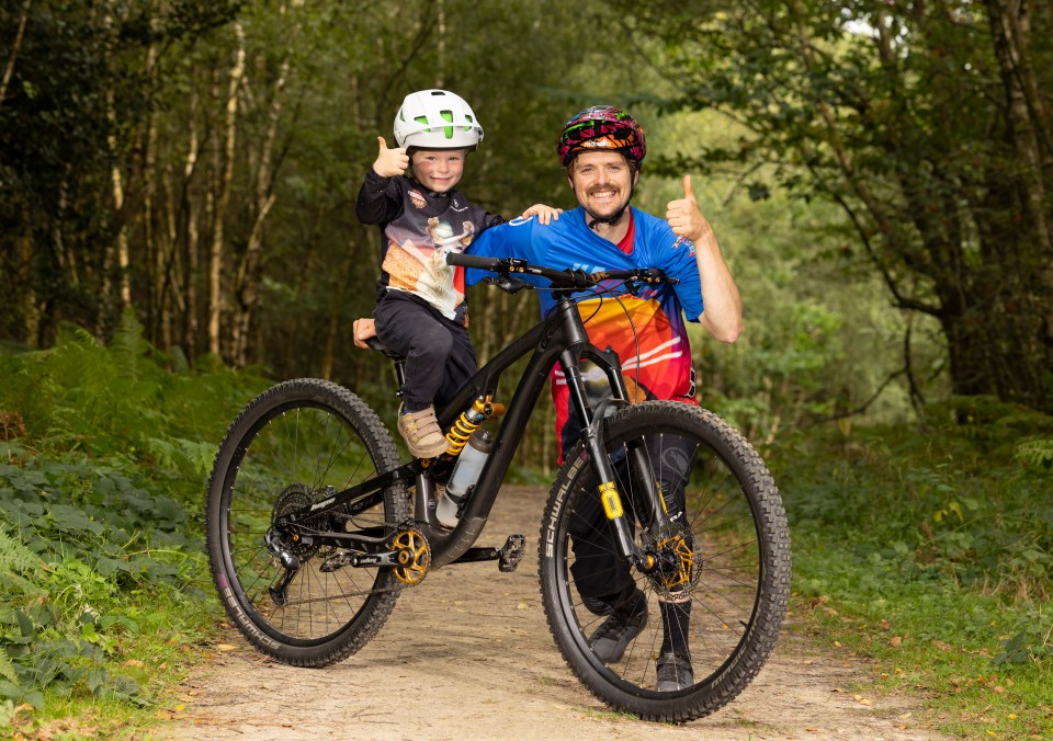 a man and a little boy are riding a bike together