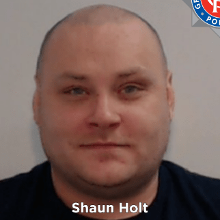 a man with the name shaun holt on his face