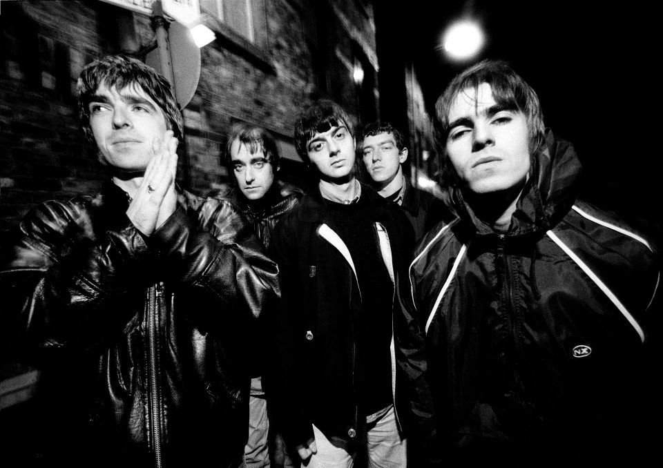 a black and white photo of the band oasis