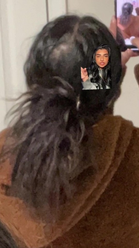 a woman with a picture of herself in her hair .