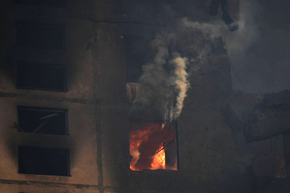 A residential building on fire after a missile attack in Kharkiv