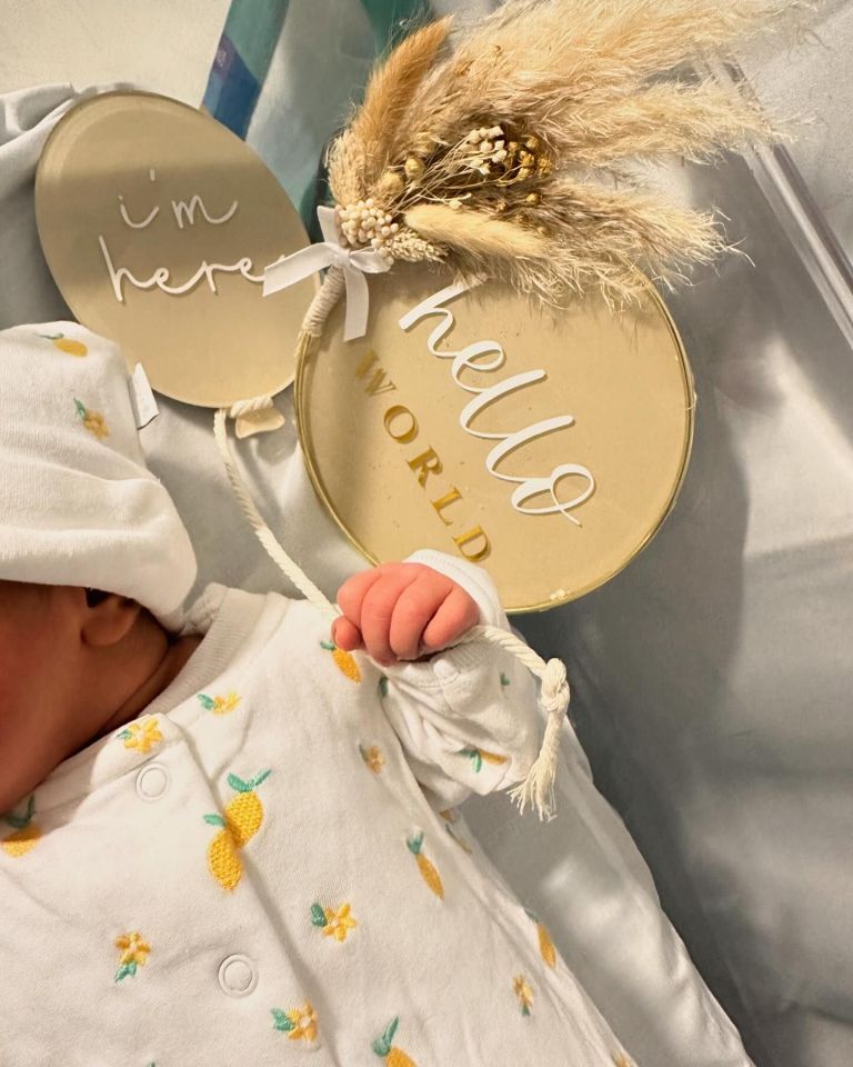 She captured the tot - whose name has not yet been revealed - sleeping soundly in her crib