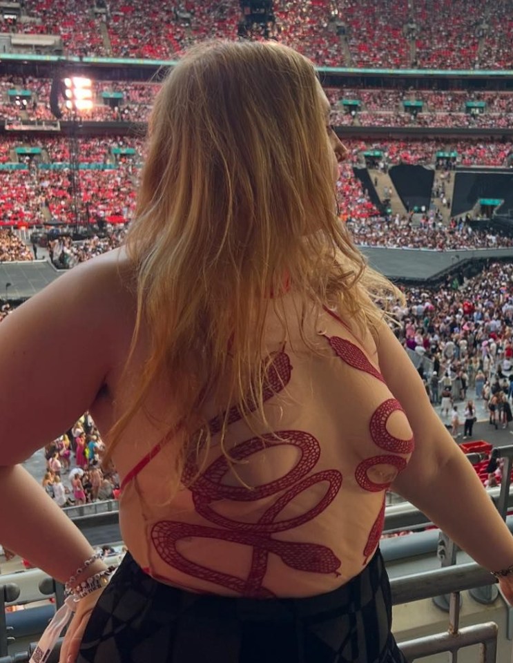 Honey looked sensational in the snake-patterned bodysuit at the Taylor Swift gig