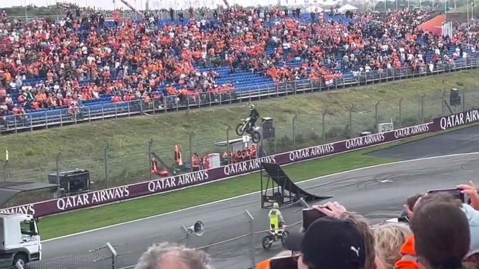 a race track with a qatar airways banner