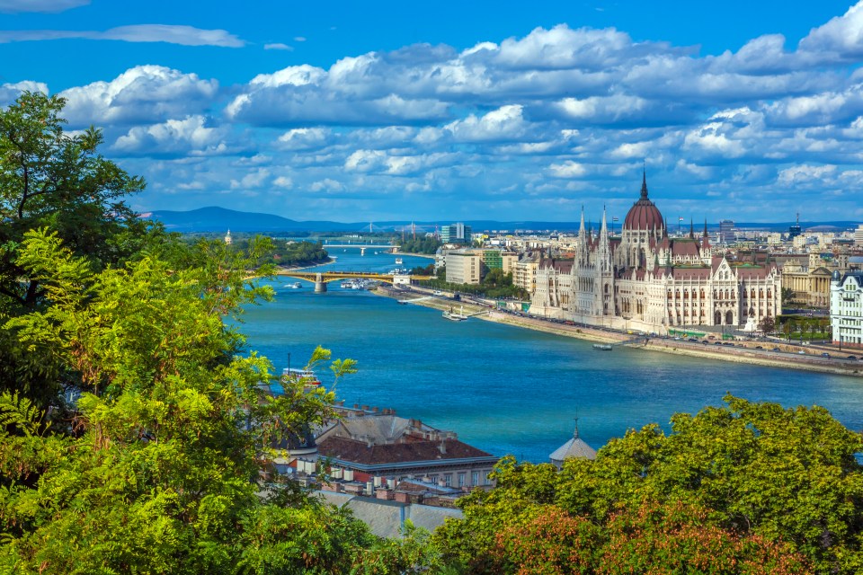 a view of a city with a river in the foreground