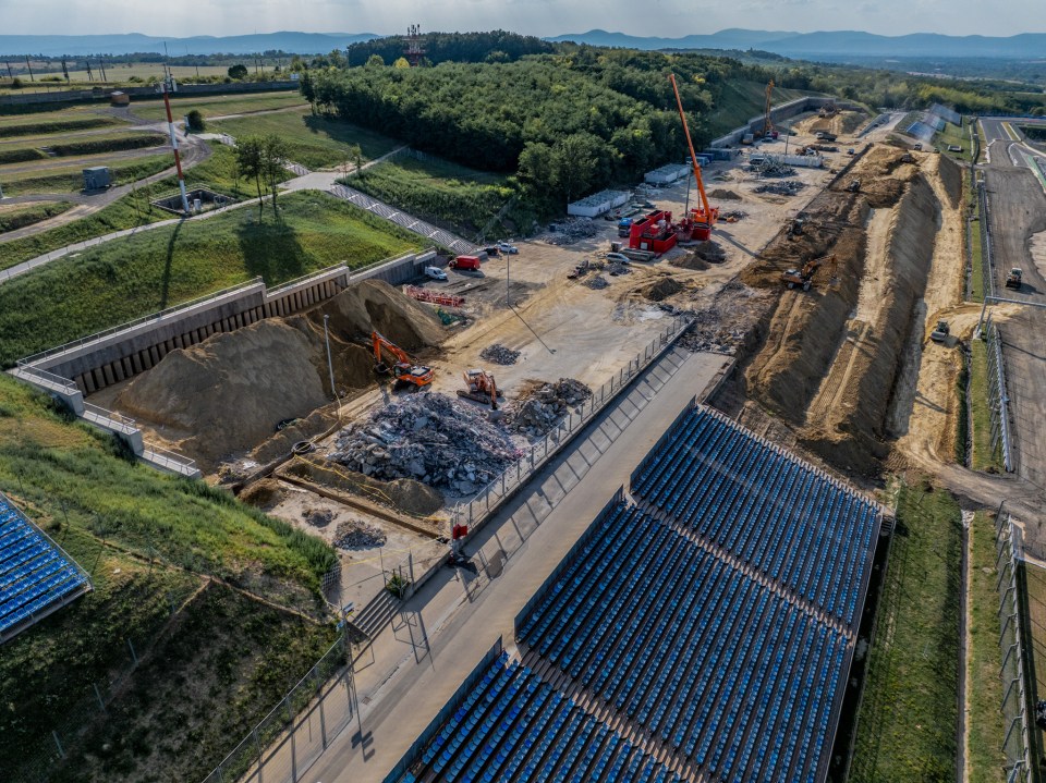 an aerial view of a construction site with blue seats