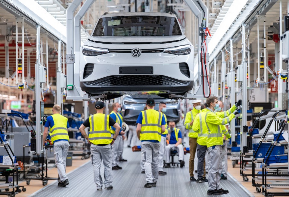 a volkswagen car is being assembled in a factory