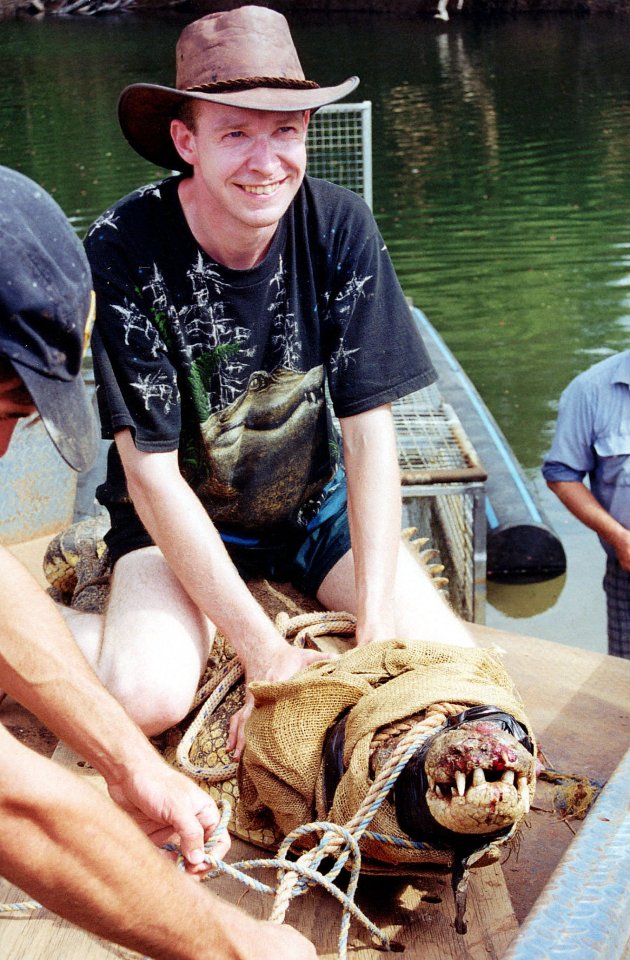 Picture Shows: Dr Adam Britton with a captured crocodile TX: BBC ONE Wednesday, May 31 2000. Living Proof' makes a big scientific discovery, the result of an intrepid hunt for a tiny molecule inside a huge predator. One of the unsolved mysteries about crocodiles is their ability to self repair. In the wild crocodiles fight all the time, incurring terrible wounds even loss of limbs. Yet they manage to survive swimming in filthy swamp water without developing gangrene. They must have in their blood, incredibly potent ways of fighting infection. 'Living Proof' follows the quest by four very different men for a new form of antibiotic.WARNING: This copyright image may be used only to publicise current BBC programmes or other BBC output. Any other use whatsoever without specific prior approval from the BBC may result in legal action.