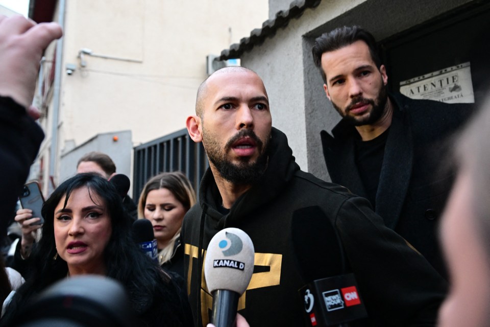 Andrew Tate, centre, and his brother Tristan, right, speak to journalists after being released from detention in Bucharest, Romania on March 12